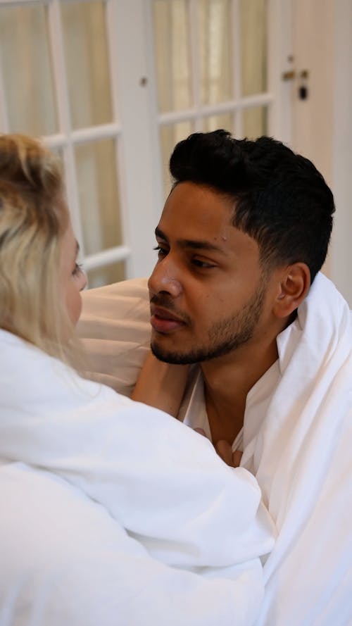 Woman Touching the Hair of a Man