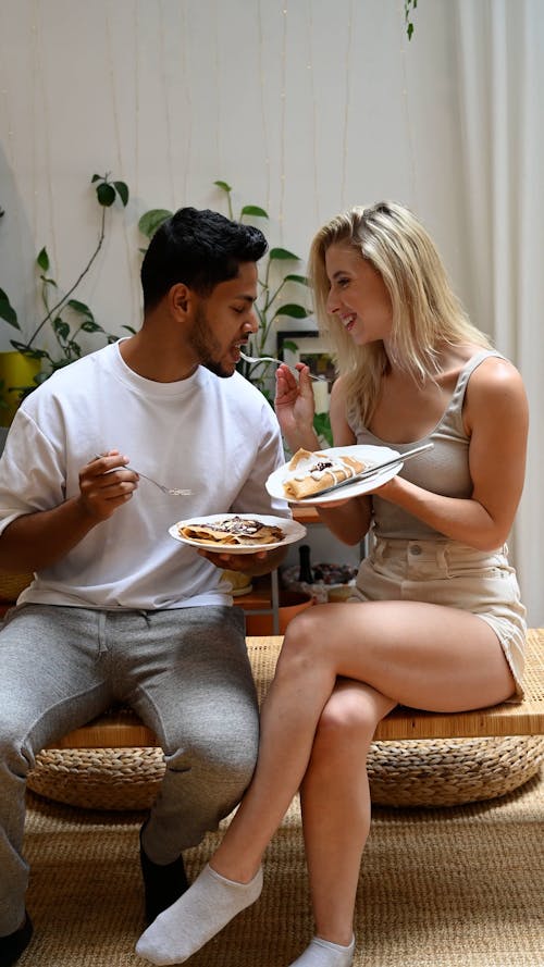 Beautiful Woman Feeding a Man
