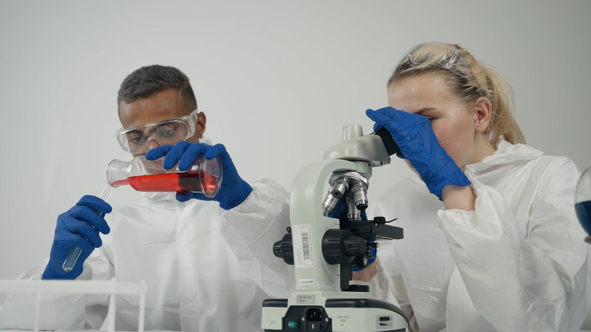 Man and Woman using Microscope Free Stock Video Footage, Royalty-Free ...