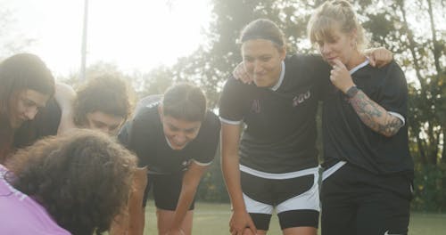 Coach Teaching his Players a Game Plan