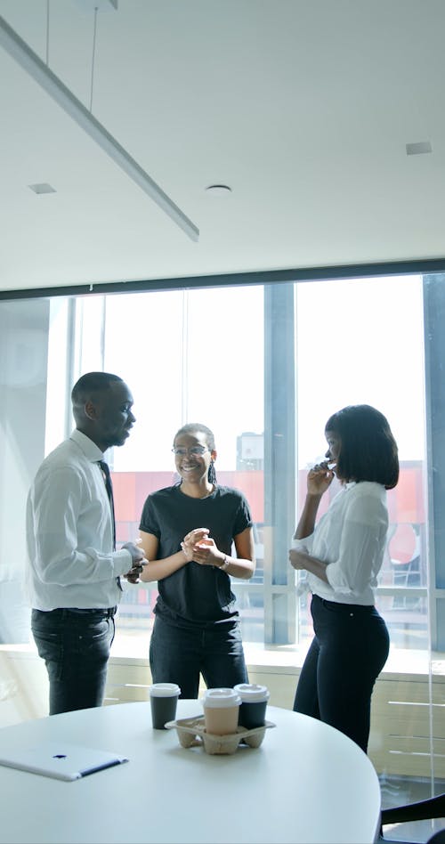 Office Workers Chatting during Coffee Break