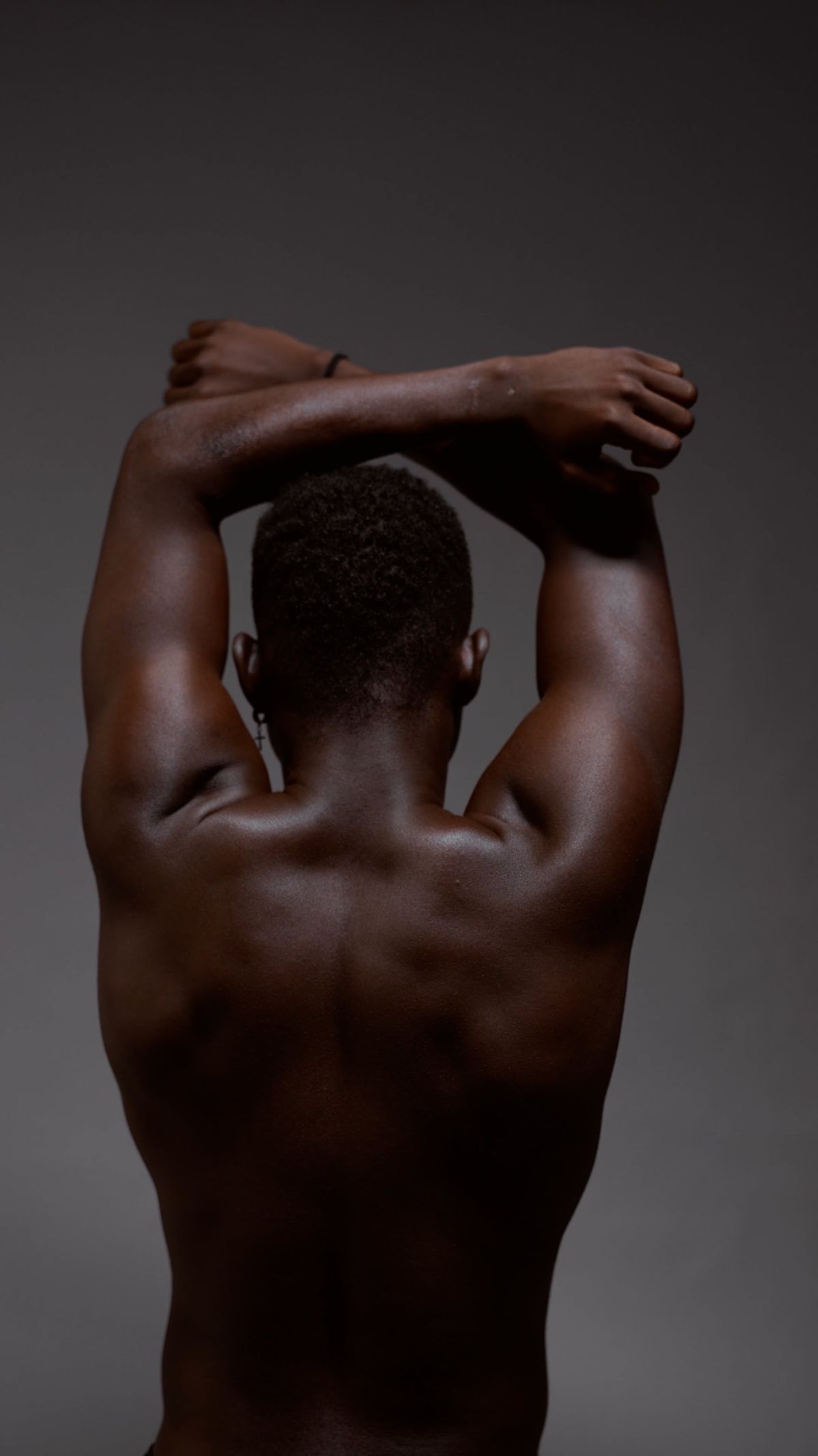 Back View of a Muscular Man Posing with his Arm Raised Free Stock Video ...