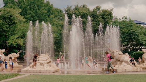 Kids Playing at an Interactive Water Fountain at Coolidge Park