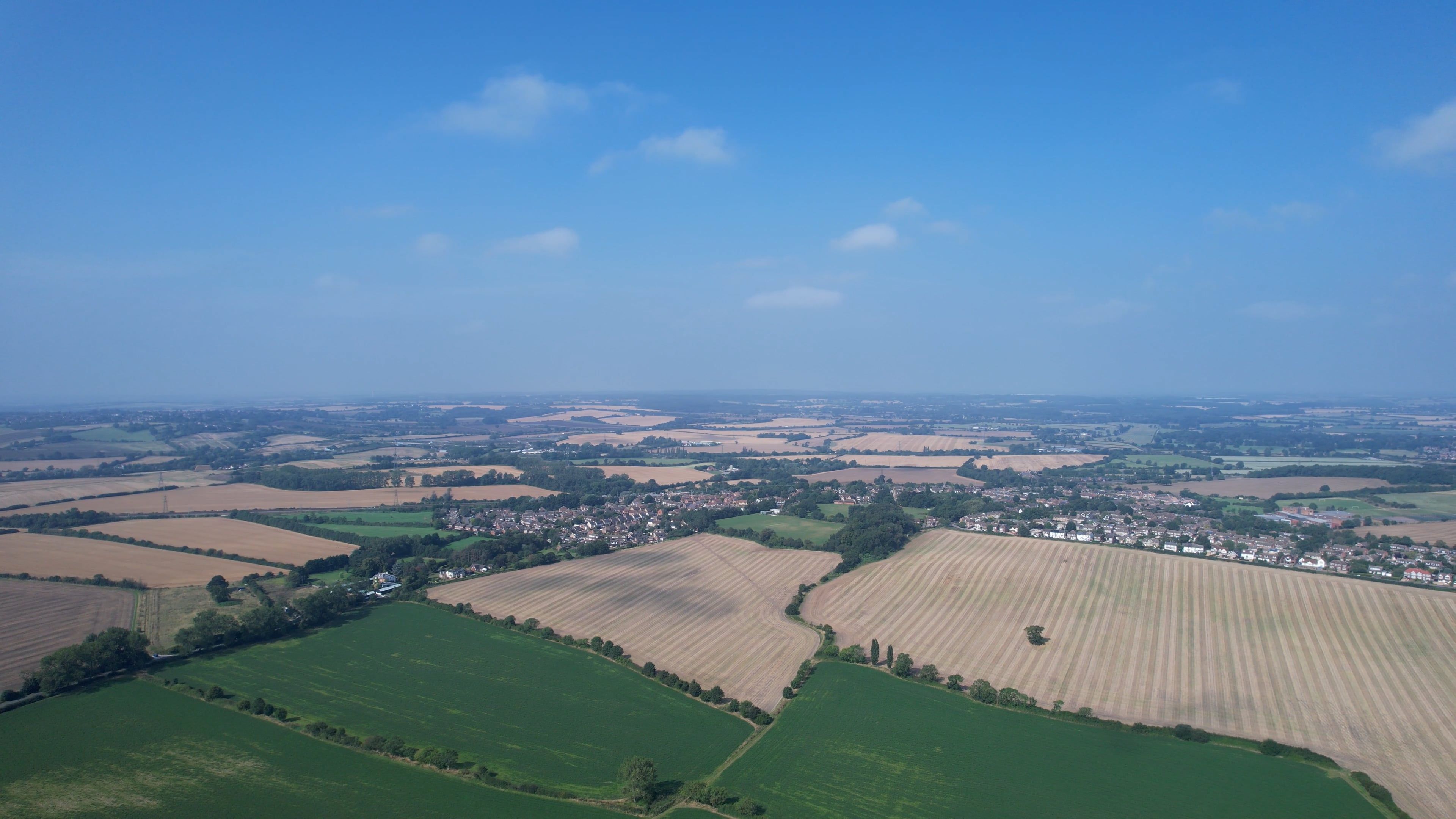 an aerial view of a rural area with fields and trees 9483828