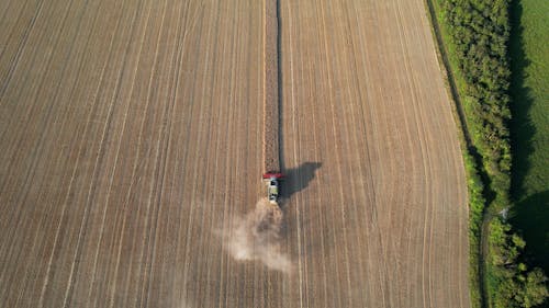 Drone Footage of a Tractor Harvesting Crops