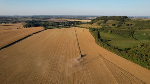 Drone Footage of a Tractor Plowing in a Field