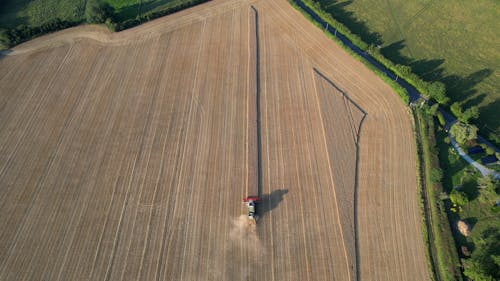 Drone Footage of a Tractor Plowing in a Field