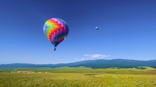 A Hot Air Balloon Flying Up in Air