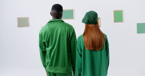 Man and Woman Looking at Blank Picture Frames