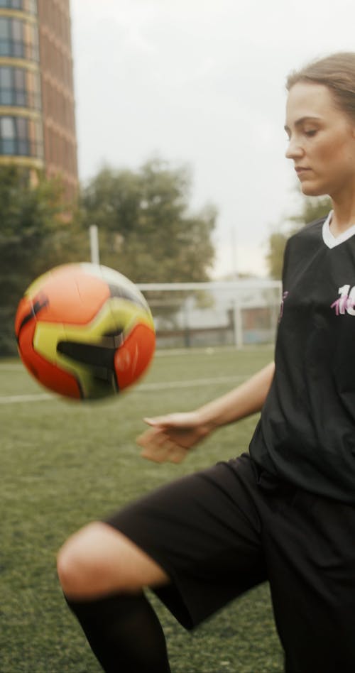 Female Soccer Player Doing Tricks with the Ball