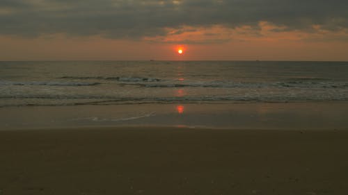 Waves Crashing on Beach Sand