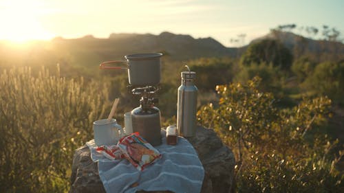 Camping Cookware on a Rock at Sunset