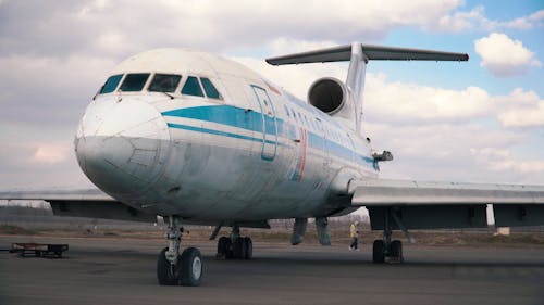 An Airplane Parked on the Runway