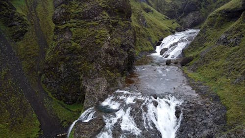 Drone Shot of a Cascade in the Mountains