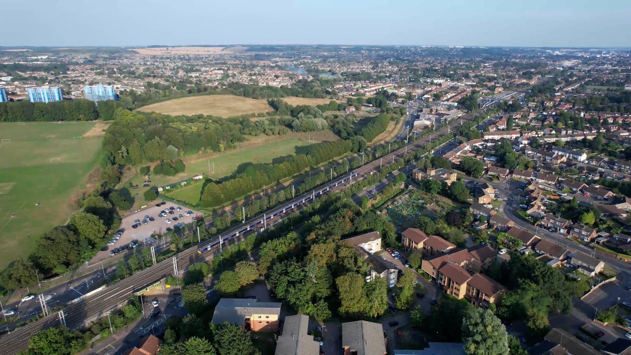 An aerial view of a city with a river and houses Free Stock Video ...