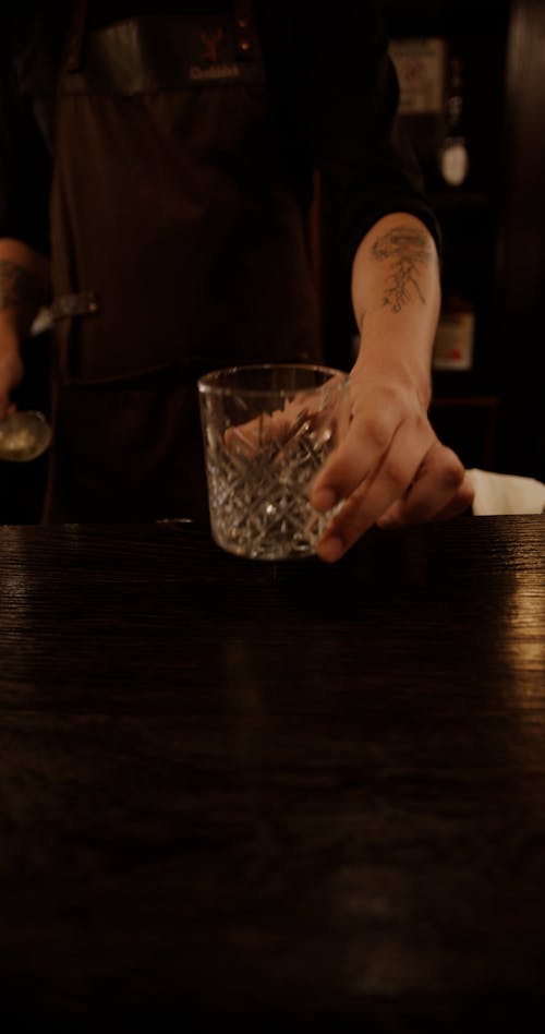 A Bartender Serving a Drink