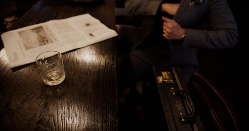 A Person Paying for a Drink at a Bar