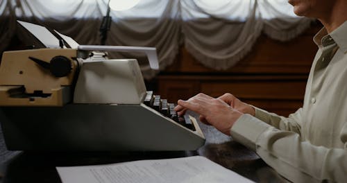 A Person Using a Typewriter