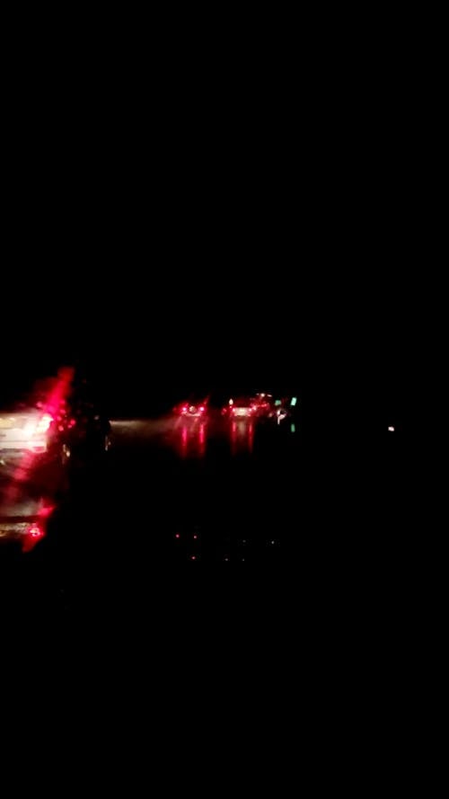 Cars Speeding at a Dark Rainy Night
