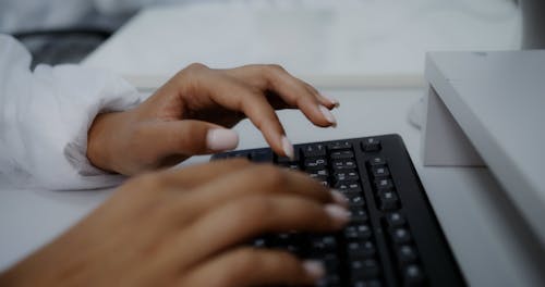 Hands Typing on the Computer Keyboard 