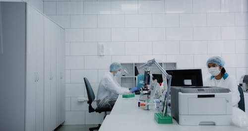 A Man and a Woman Working at a Laboratory