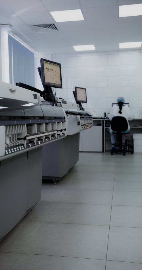 A Man Putting the Blood Samples in a Machine