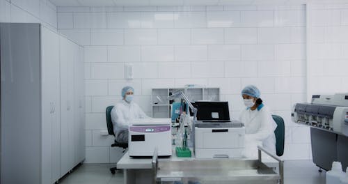 Medical Practitioners Working in a Laboratory