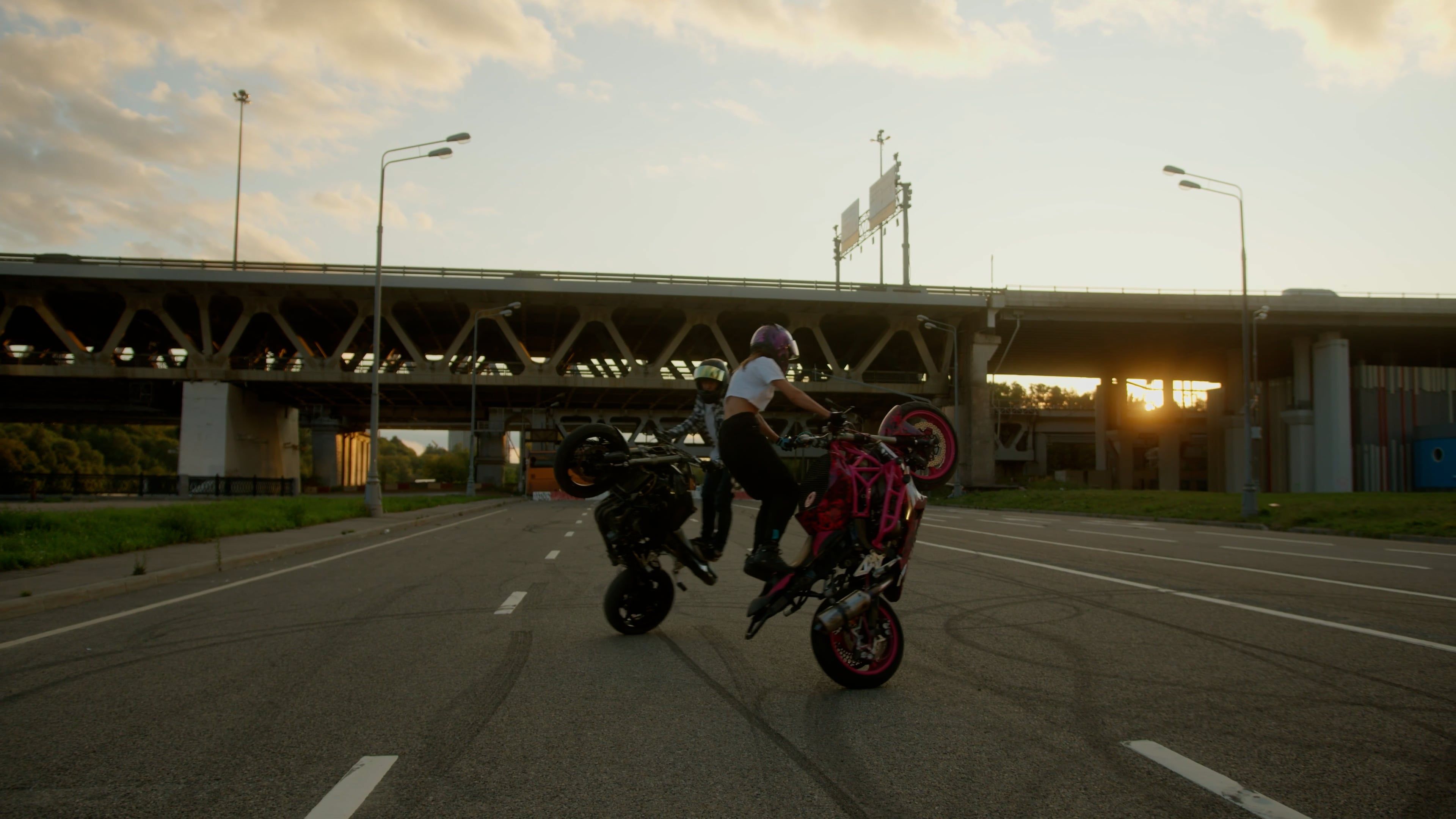 A Couple of Motorcyclists Doing Stunts in the Street Free Stock Video ...