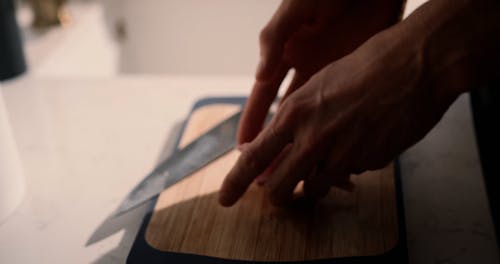 Person Slicing Meat 