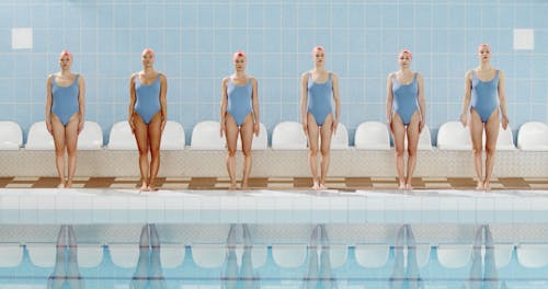 Women Getting Ready to Dive on the Pool