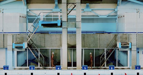 Women Walking Up the Stairs wearing Swimwear