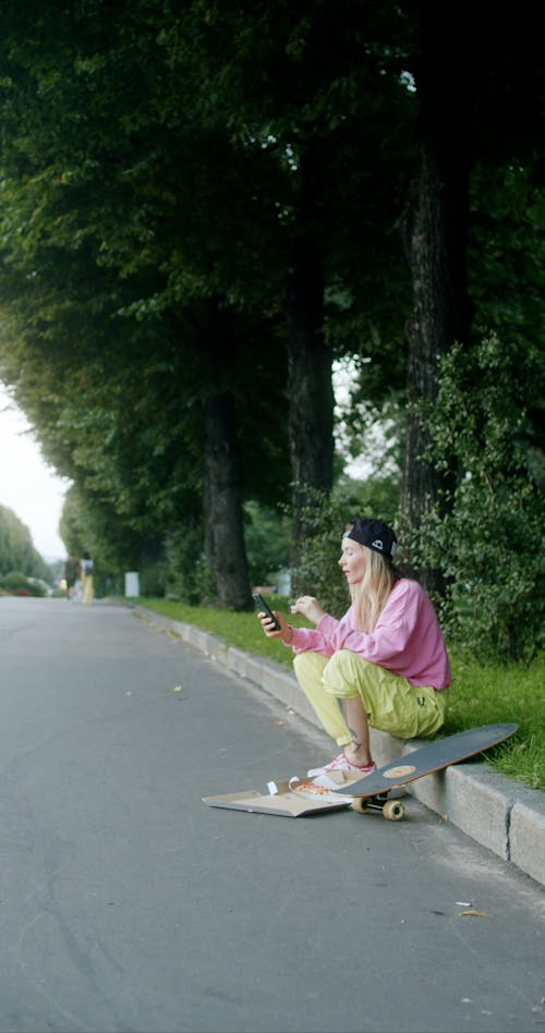 Woman Sitting on the Street