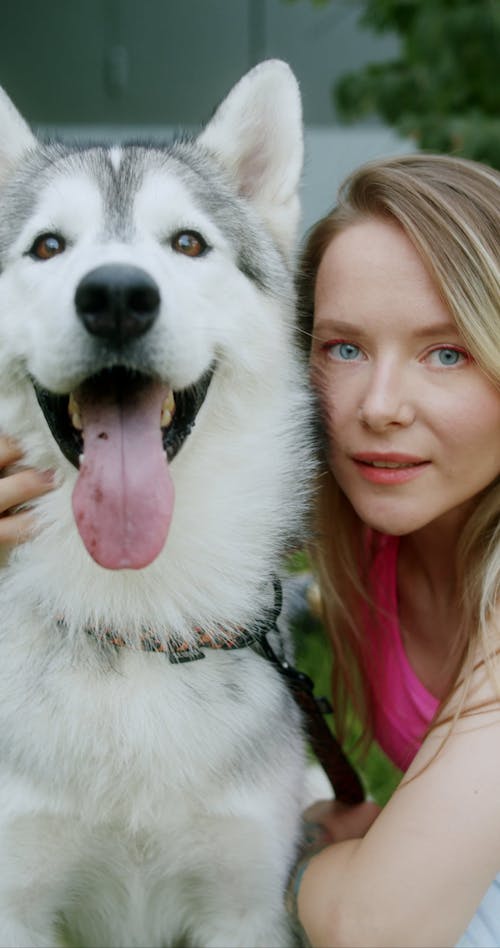 A Woman Petting Her Dog