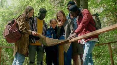 backpacking friends looking at a map
