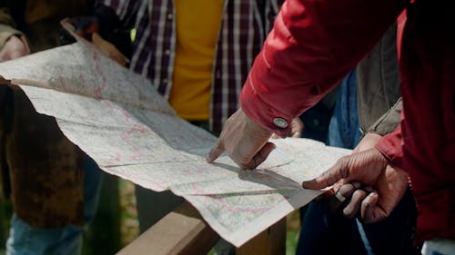 Travelers Checking the Map for Direction