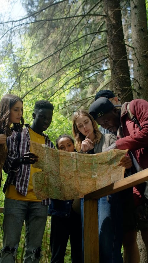 Group of Tourist Looking at a Map