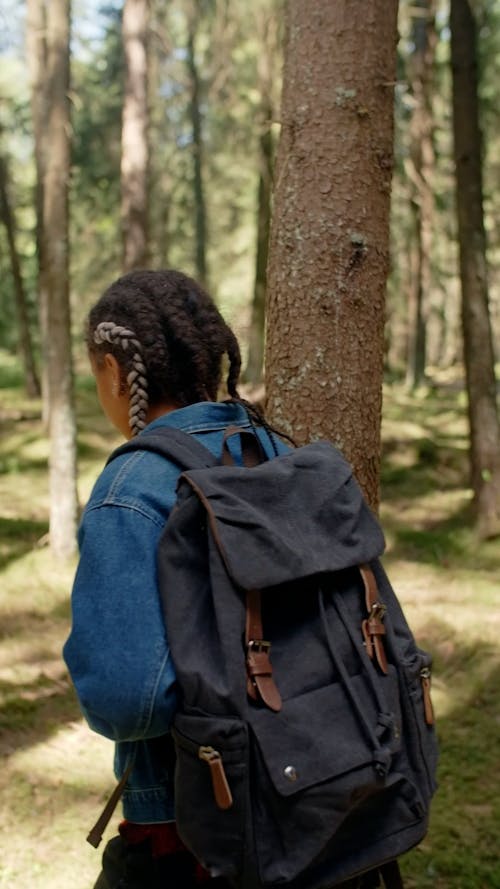 Two Female Backpackers Walking in the Woods