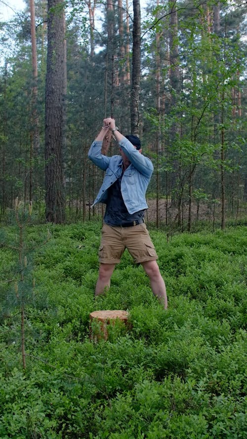 A Man Cutting a Firewood