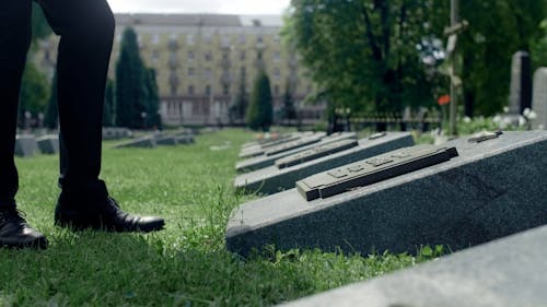 A Person Touching the Tombstone