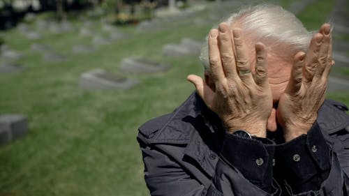 Elderly Man Wiping His Tears