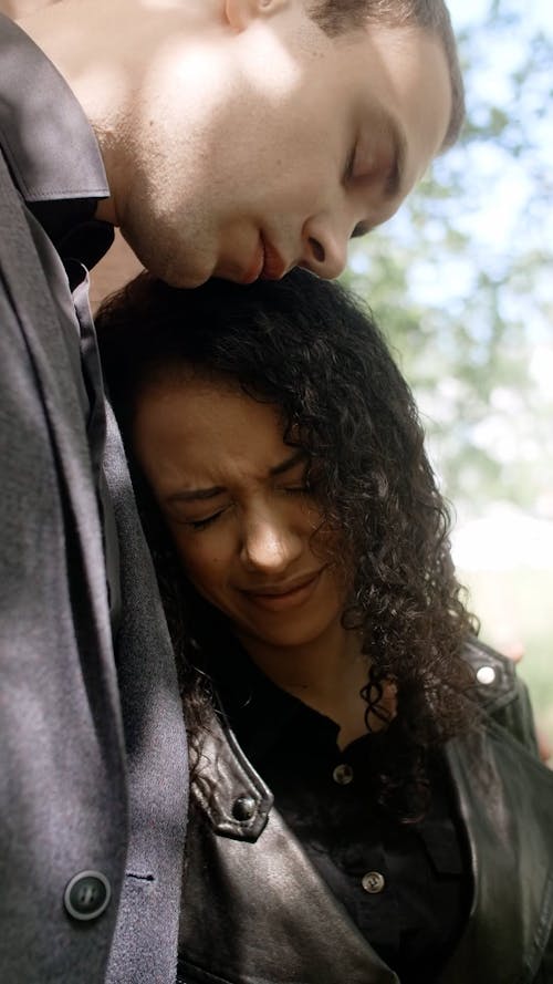 Person Comforting a Crying Woman