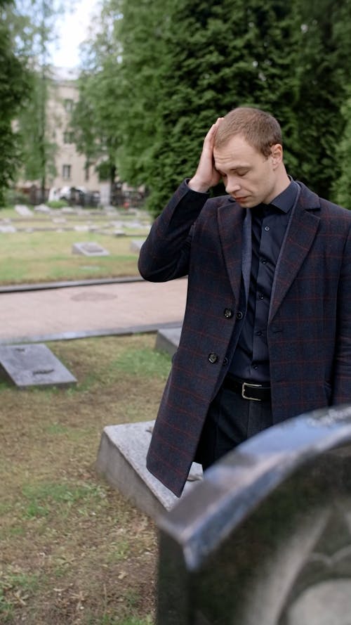 Sad Man at the Cemetery