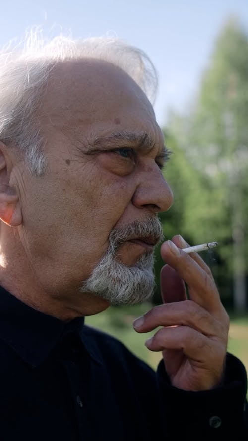 Close Up of an Elderly Man Smoking 