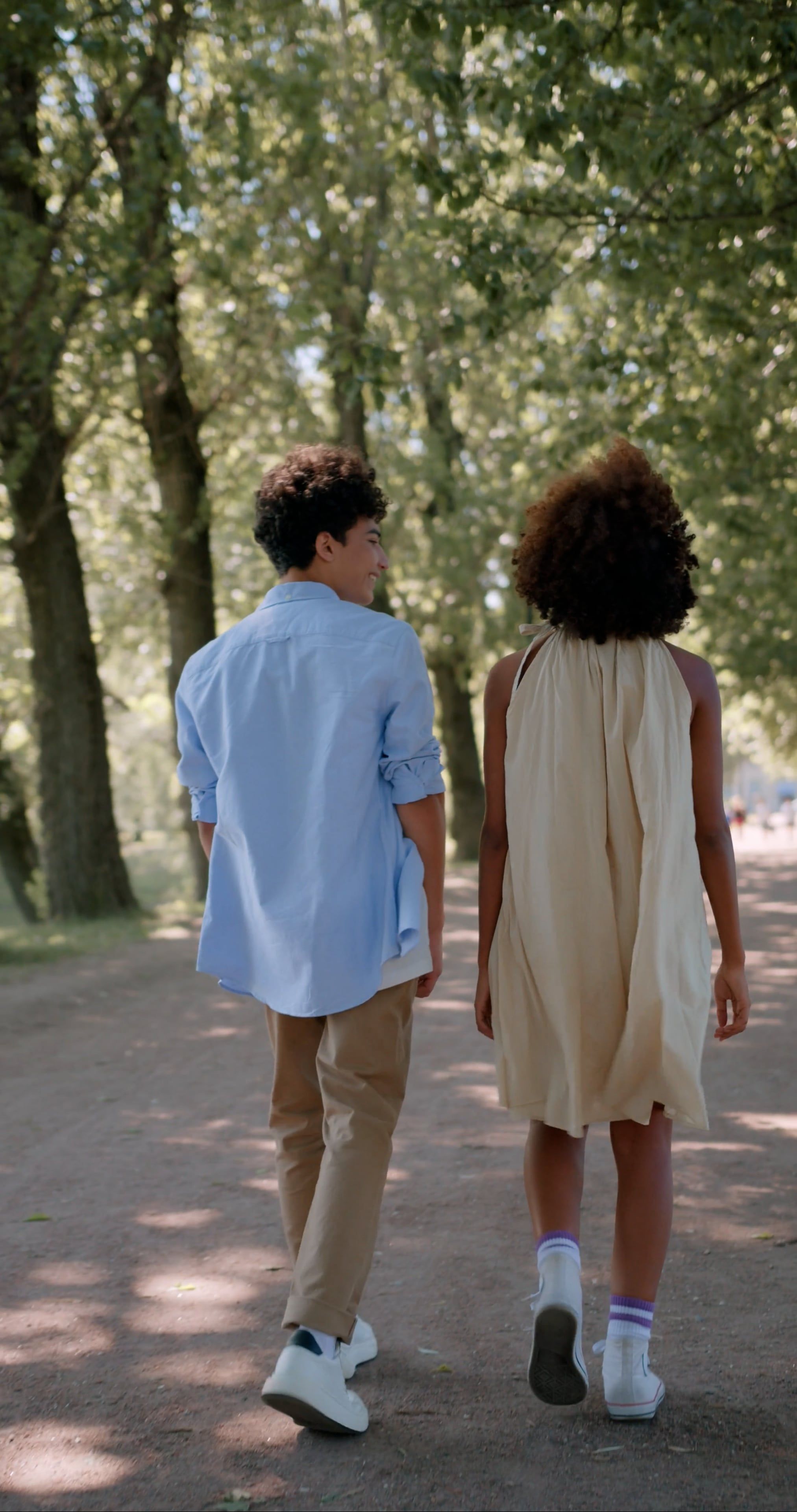 Back View Footage of a Couple Holding Each Others Hand While Walking in ...