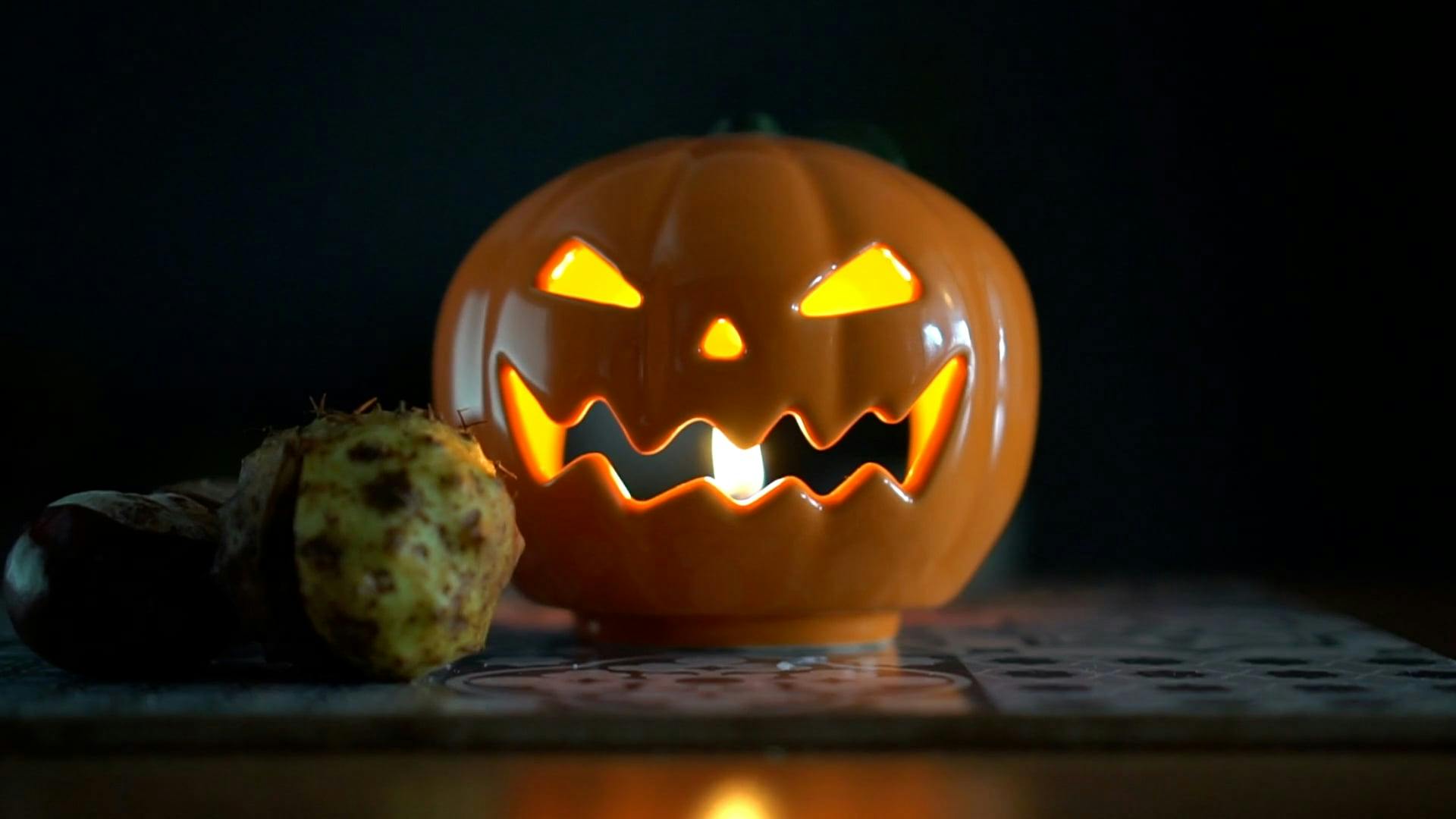 Close up of a Candle inside a Jack O Lantern · Free Stock Video