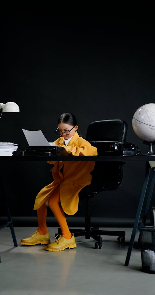 A Little Girl Working at an Office