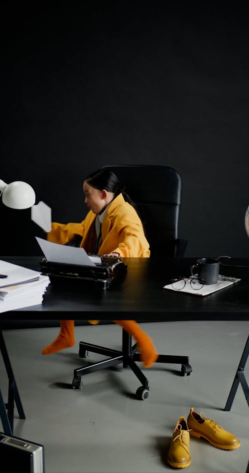 A Girl Sitting on an Office Chair 