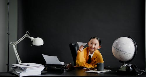 Cute Girl Throwing a Paper Plane