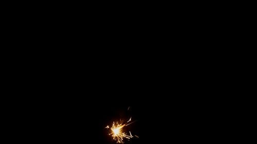 Close-Up Video of Burning Sparkler on Black Background