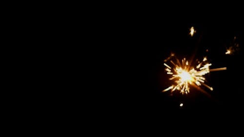 Close-Up Video of Burning Sparklers on Black Background
